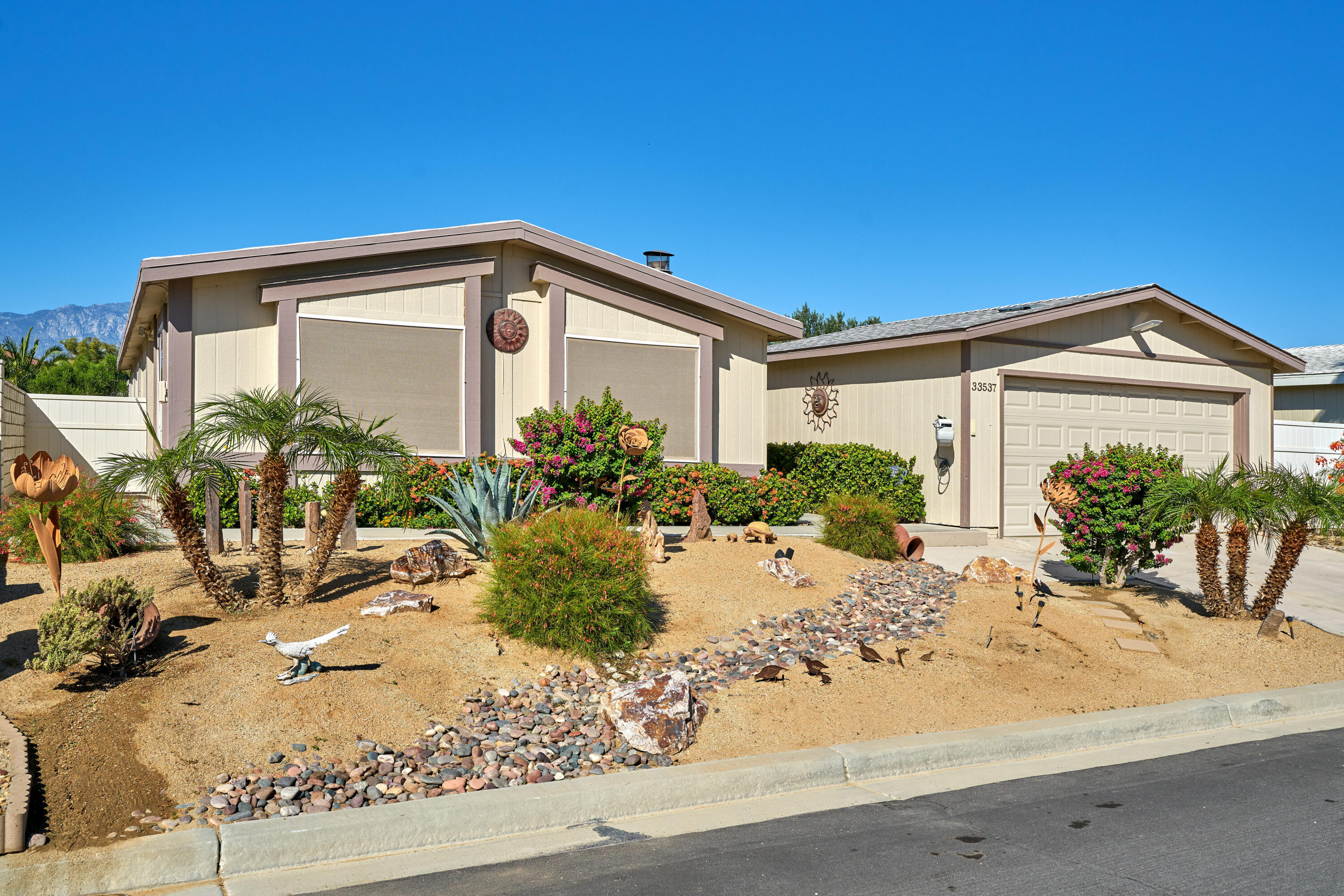 33537 Lisa Circle Thousand Palms, CA 92276 - Photo 2 of 35 a front view of a house with a yard