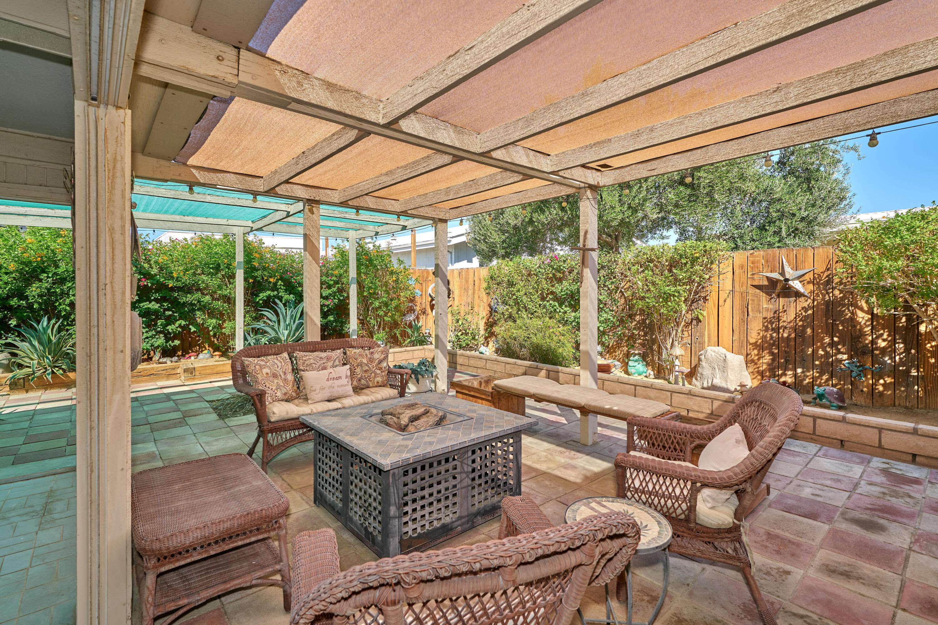 33537 Lisa Circle Thousand Palms, CA 92276 - Photo 24 of 35 a outdoor space with patio the couches and a dining table with garden view