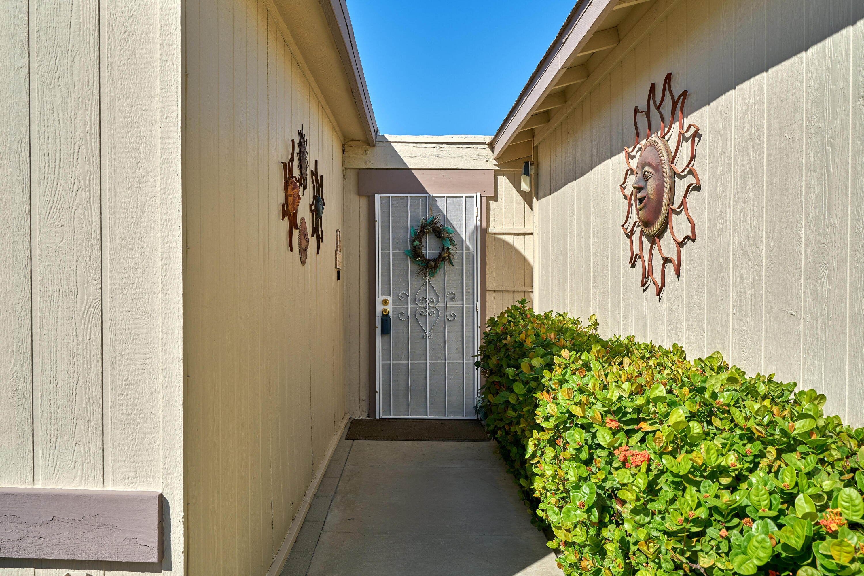 33537 Lisa Circle Thousand Palms, CA 92276 - Photo 3 of 35 a door view with a potted plant