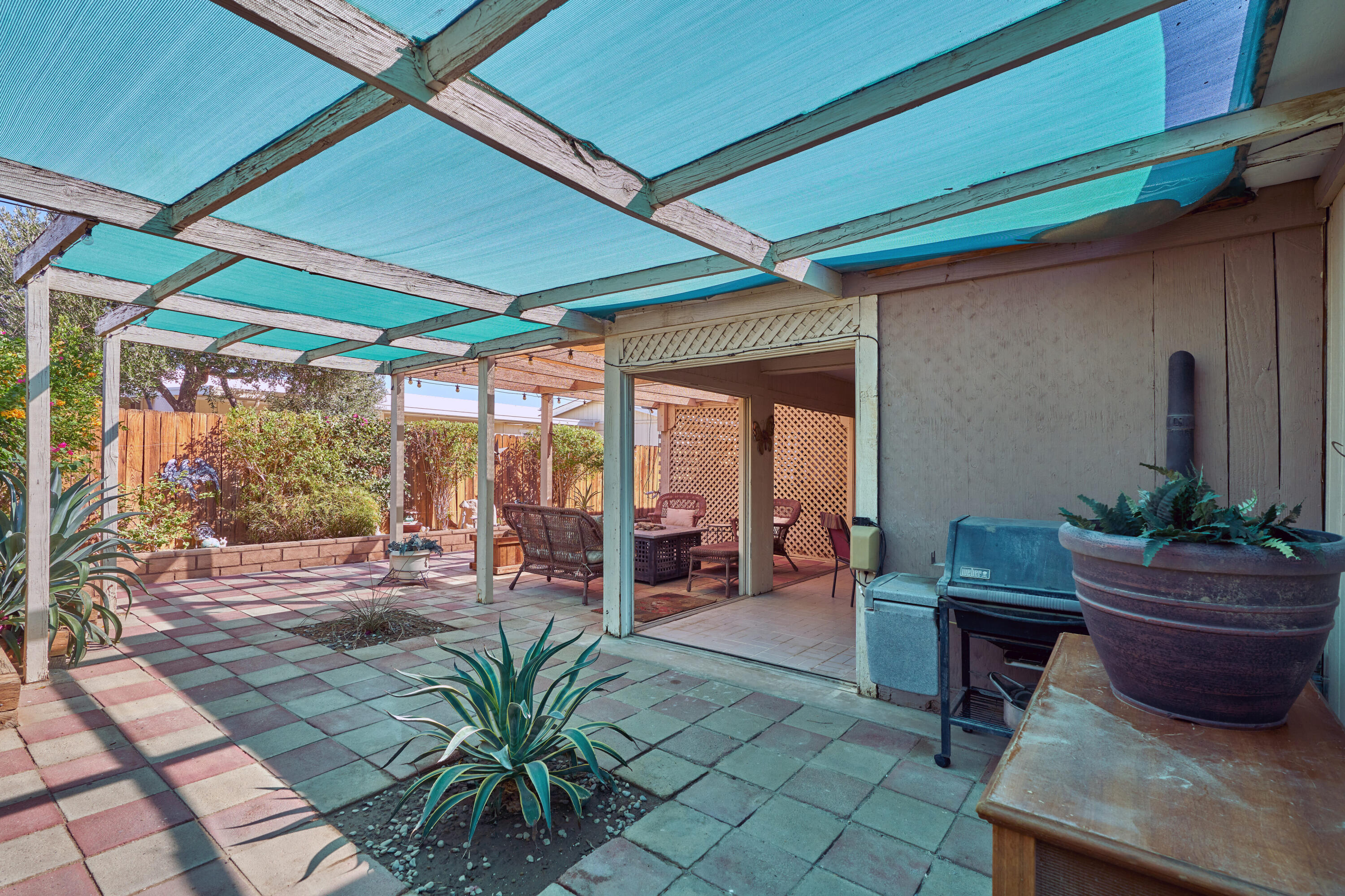 33537 Lisa Circle Thousand Palms, CA 92276 - Photo 31 of 35 a view of a porch with chairs and potted plants