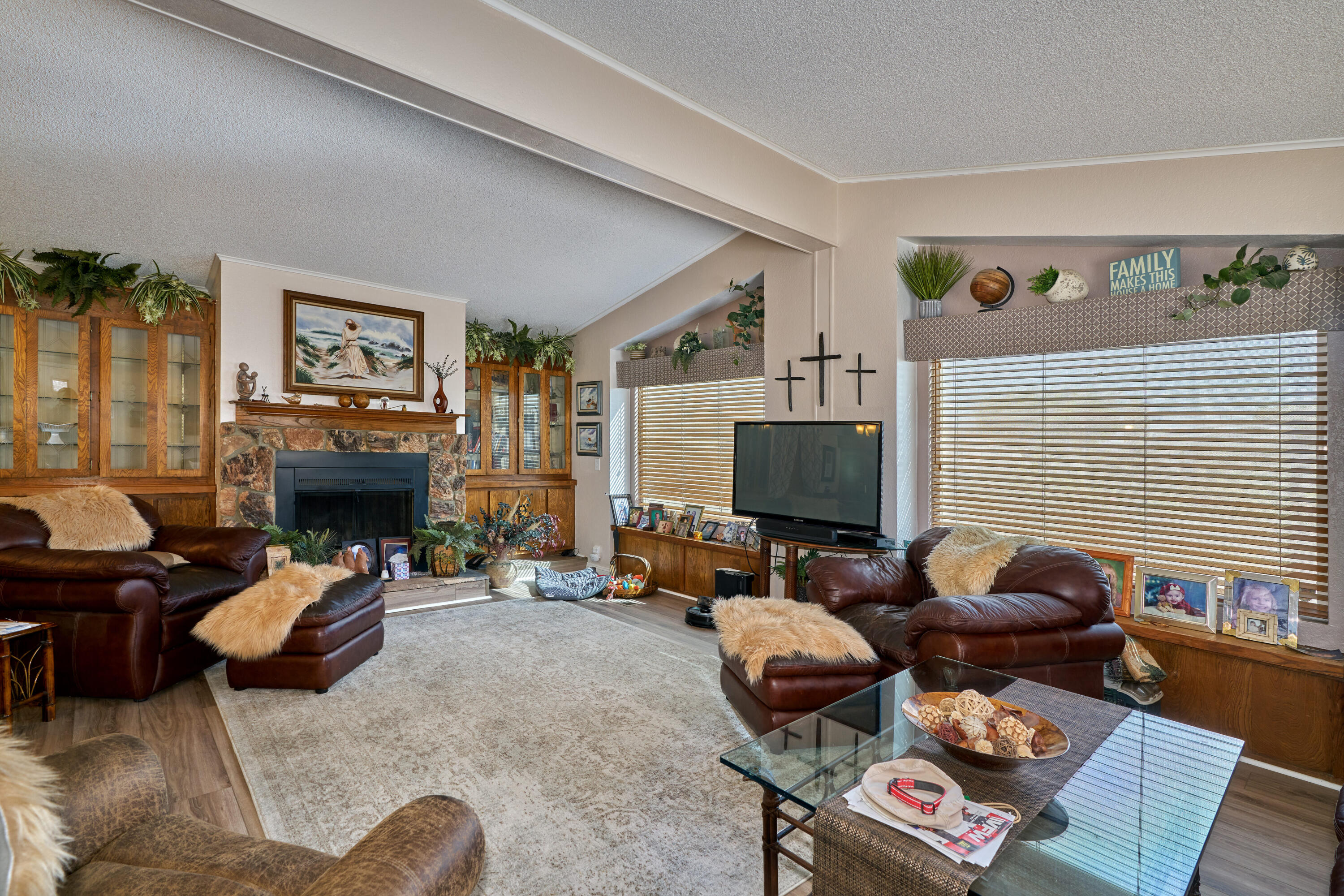 33537 Lisa Circle Thousand Palms, CA 92276 - Photo 4 of 35 a living room with furniture a fireplace and a flat screen tv