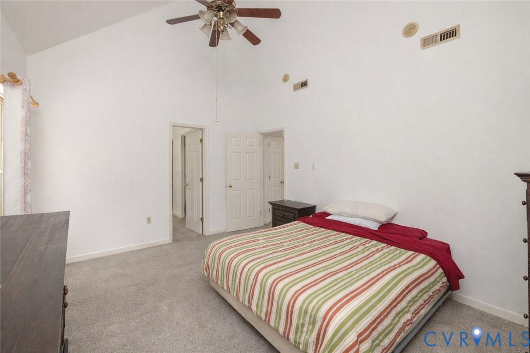 10 Rhodes Lane Cartersville, VA 23027 - Photo 15 of 16 Bedroom with light colored carpet, lofted ceiling,