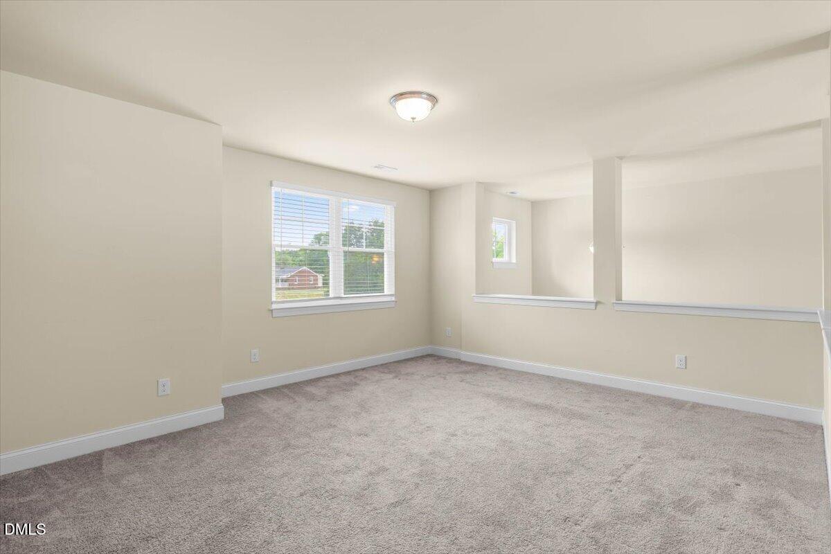 704 Haw River Hopedale Road Burlington, NC 27217 - Photo 27 of 49 an empty room with windows