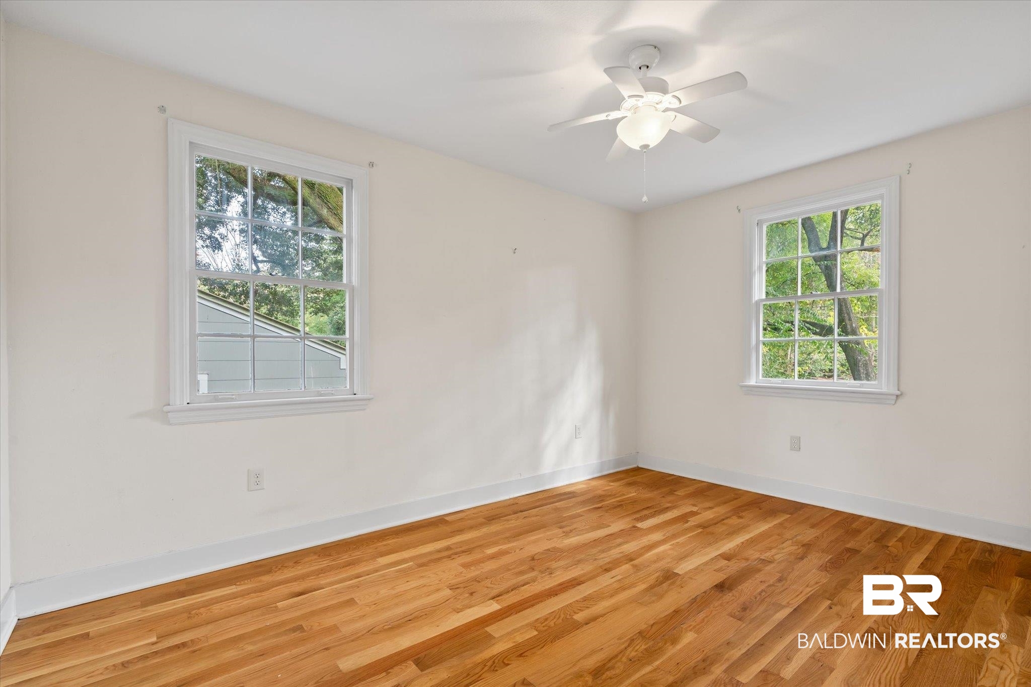 5113 Norton Lane Mobile, AL 36608 - Photo 9 of 20 Unfurnished room featuring ceiling fan and light hardwood / wood-style floors