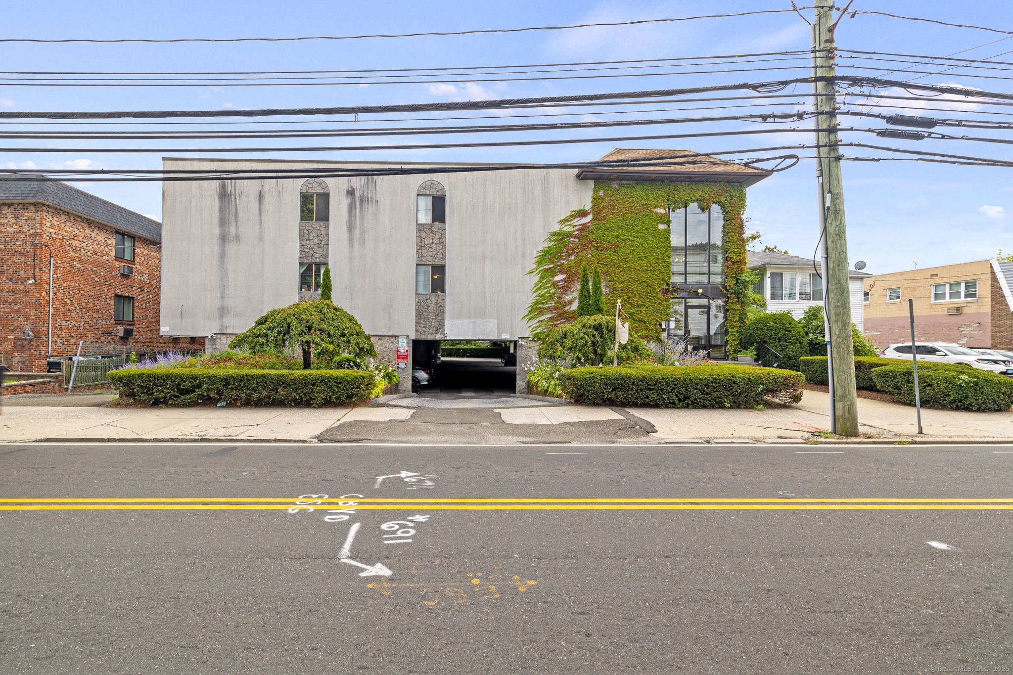 697 Cove Road, Unit 2A Stamford, CT 06902 - Photo 1 of 1 a view of a house with a garden