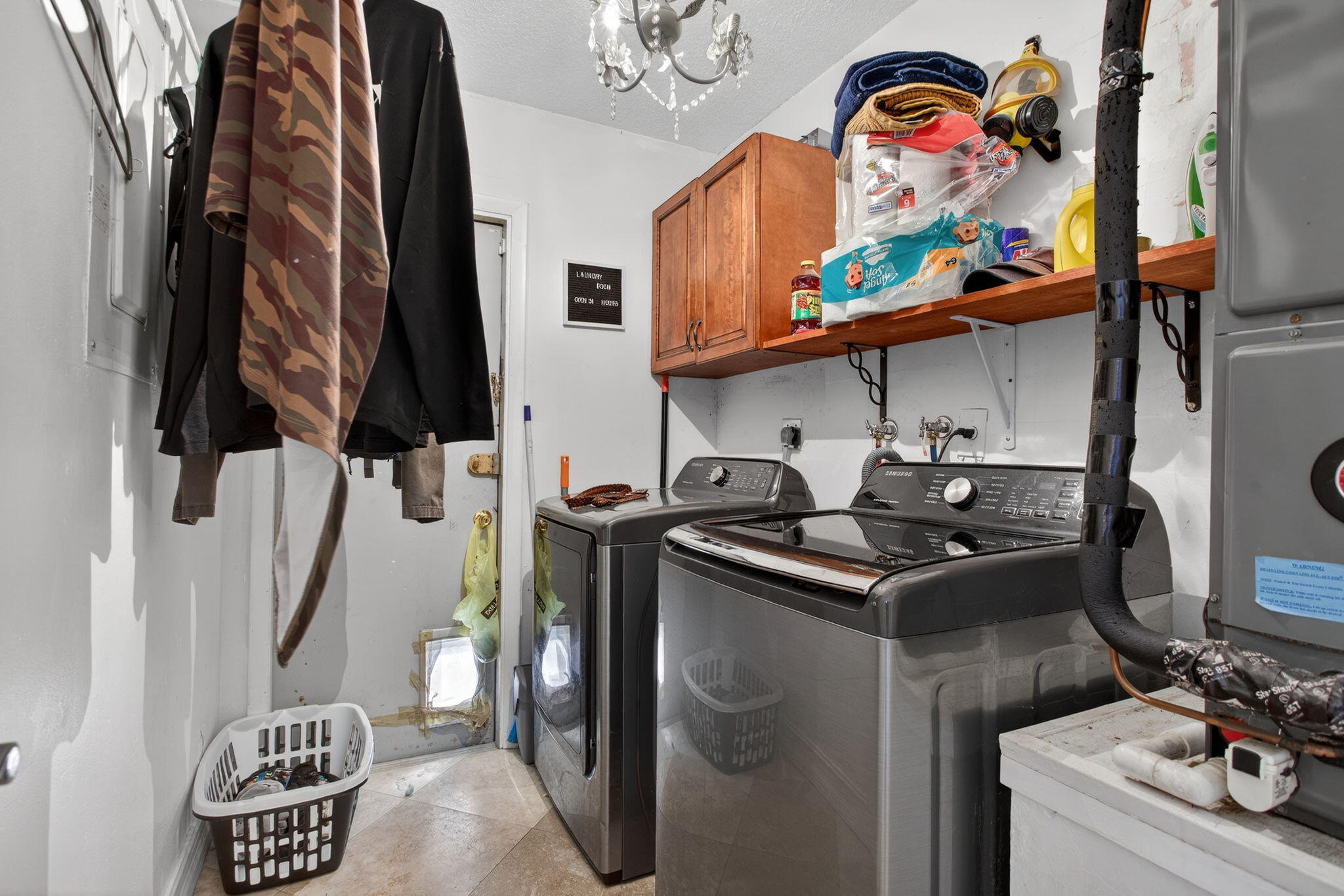 415 Southwest 61st Terrace Margate, FL 33068 - Photo 16 of 39 a view of walk in closet with clothes and shoes