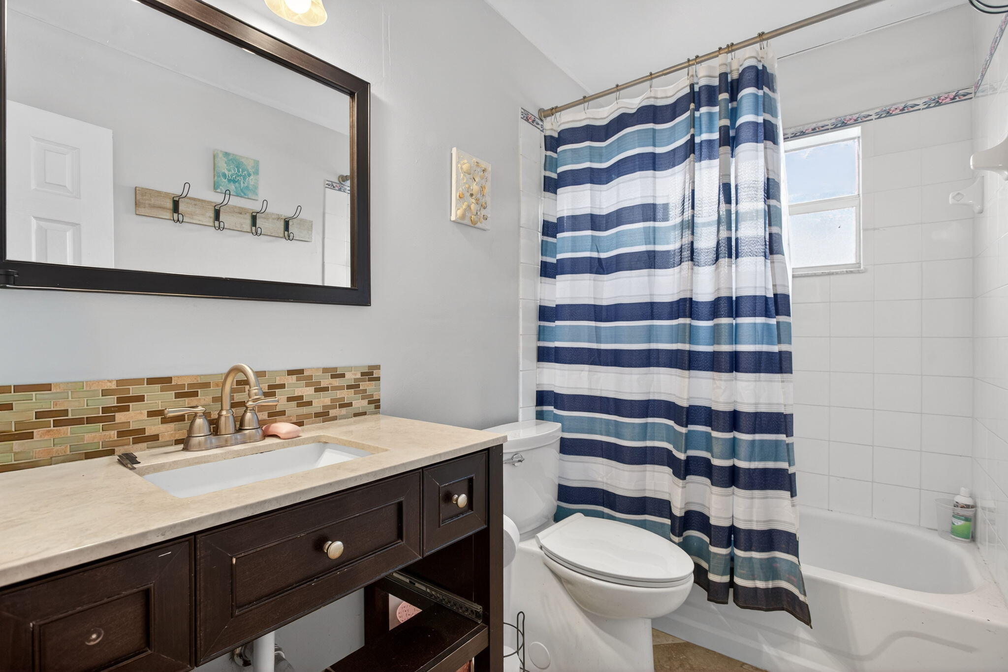 415 Southwest 61st Terrace Margate, FL 33068 - Photo 18 of 39 a bathroom with a sink toilet and shower