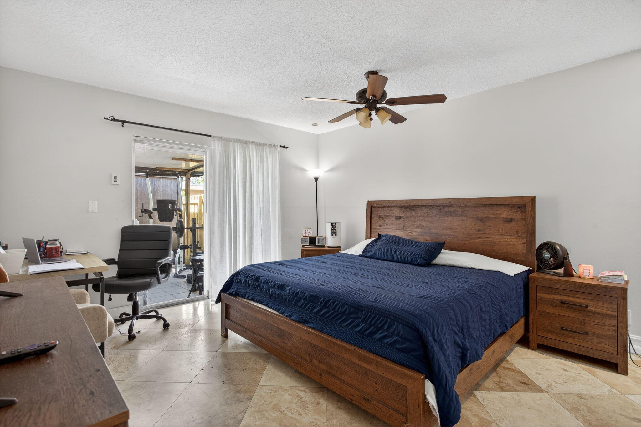 415 Southwest 61st Terrace Margate, FL 33068 - Photo 22 of 39 a bedroom with a bed a desk and chair