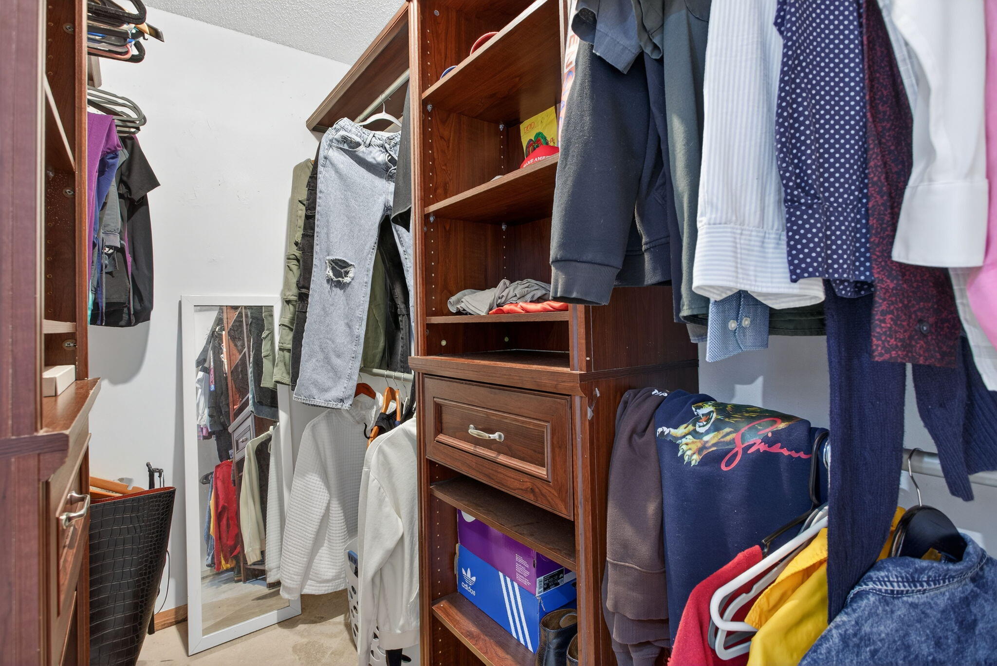 415 Southwest 61st Terrace Margate, FL 33068 - Photo 23 of 39 a view of walk in closet with clothes and shoes