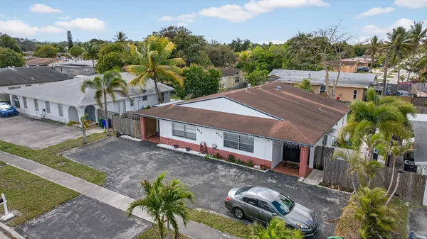 a aerial view of a house with a yard