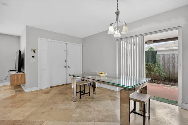 a view of a livingroom with furniture and front door