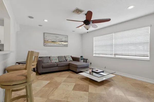 a living room with furniture and a window