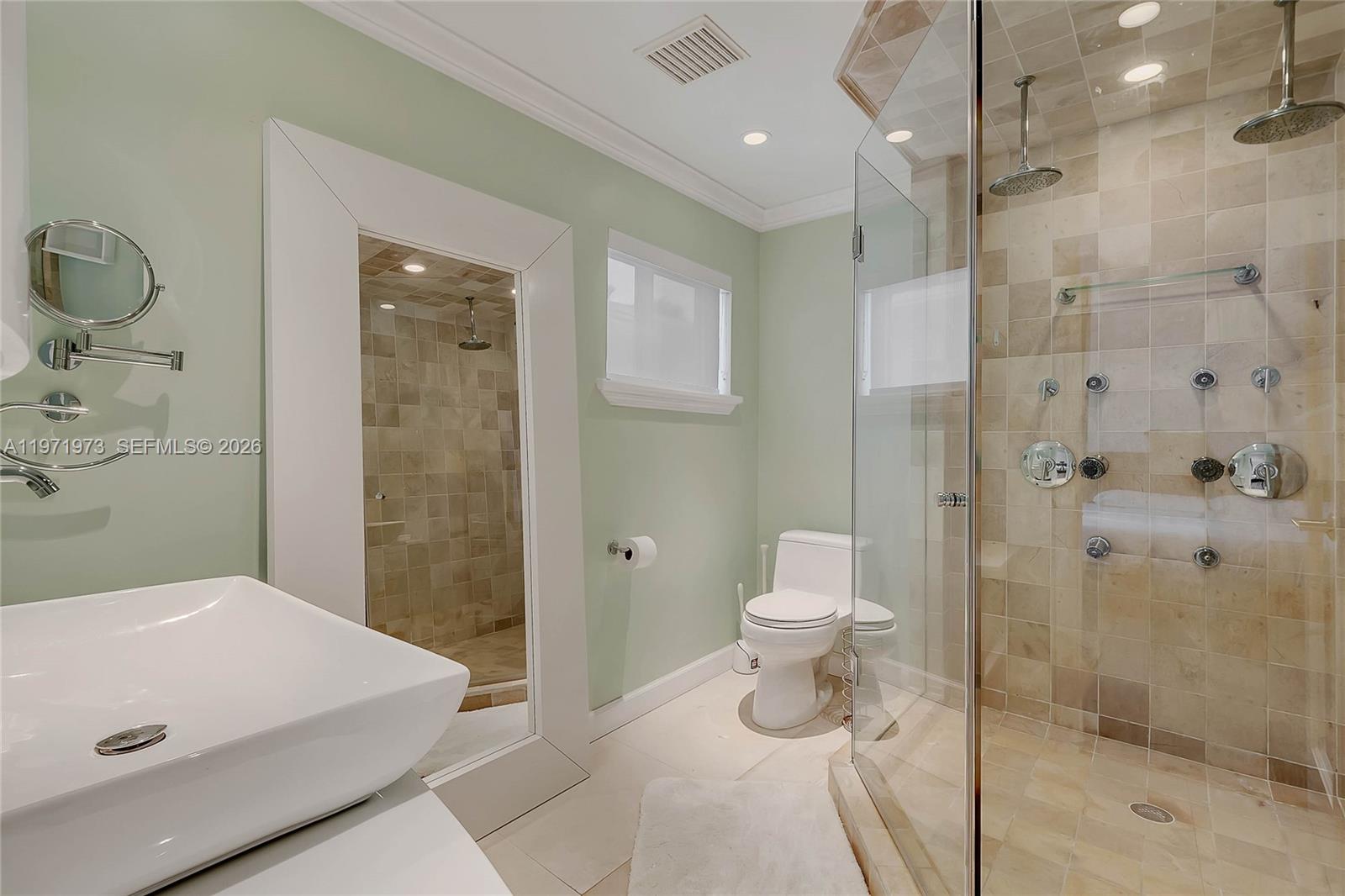 35 Southwest 20th Road Miami, FL 33129 - Photo 14 of 50 a bathroom with a toilet sink and shower