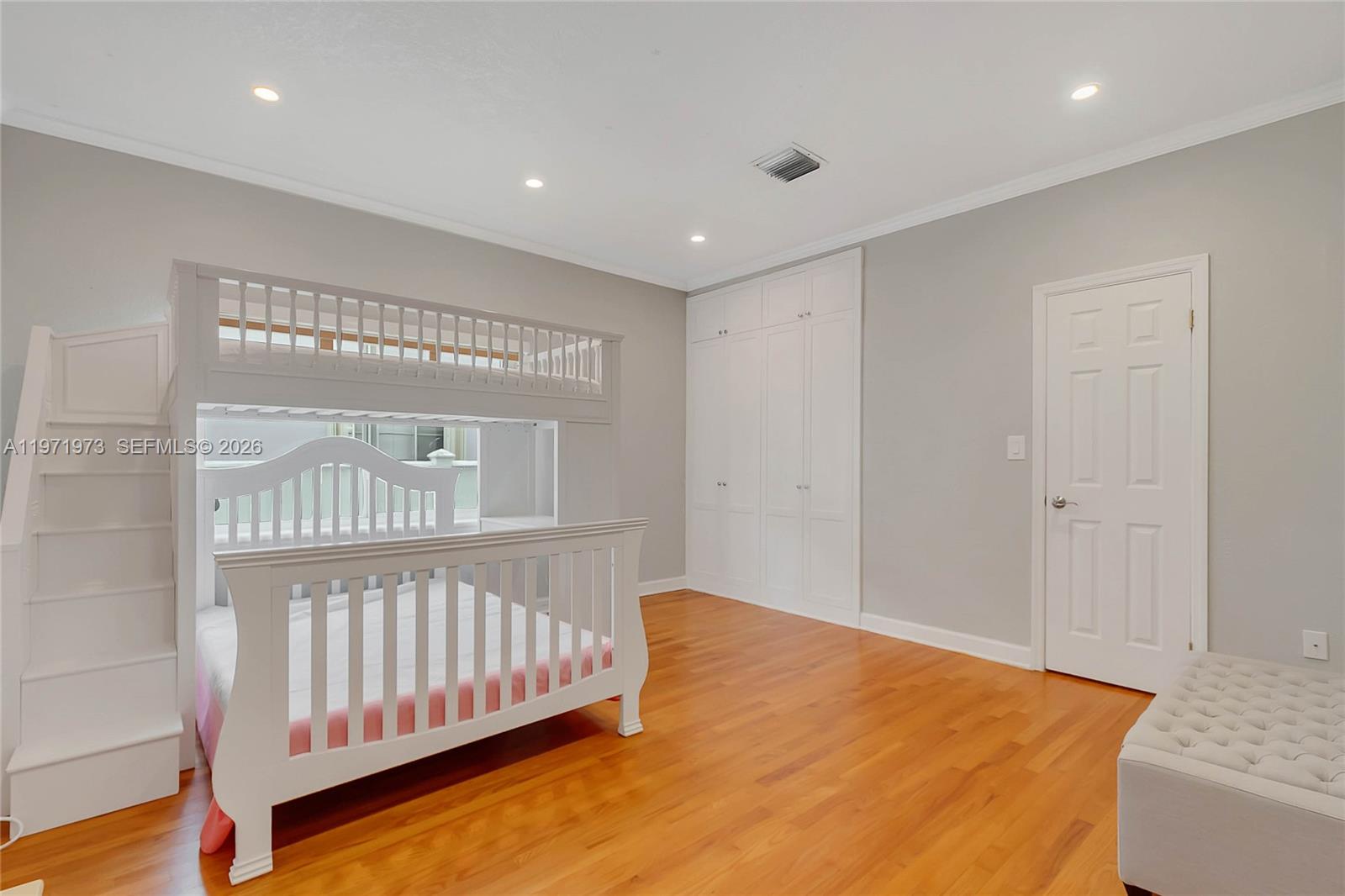 35 Southwest 20th Road Miami, FL 33129 - Photo 16 of 50 a view of a bedroom with wooden floor