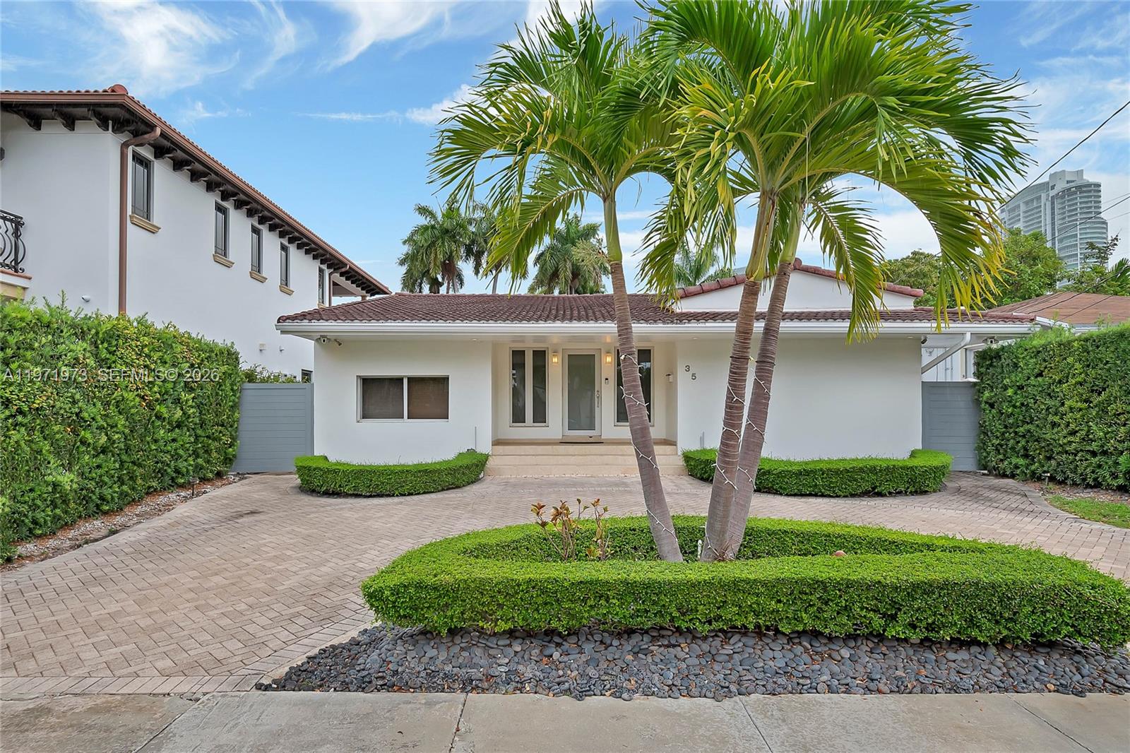 35 Southwest 20th Road Miami, FL 33129 - Photo 3 of 50 a front view of a house with garden and plants