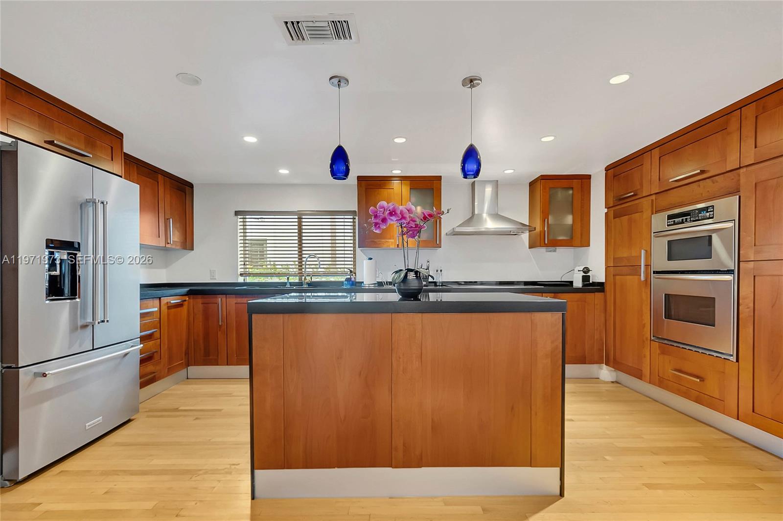 35 Southwest 20th Road Miami, FL 33129 - Photo 9 of 50 a kitchen with stainless steel appliances granite countertop a refrigerator and a sink