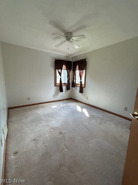 1126 Mudbrook Road Huron, OH 44839 - Photo 14 of 22 Carpeted spare room with ceiling fan