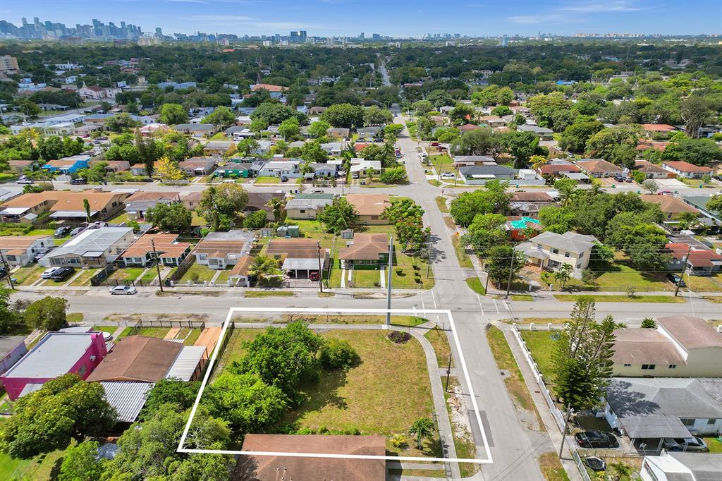 1895 Northwest 58th Street Miami, FL 33142 - Photo 3 of 14 an aerial view of residential houses with outdoor space and city view