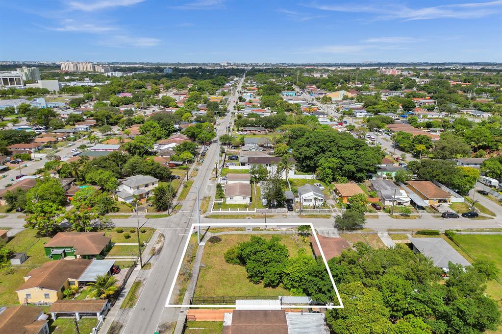 1895 Northwest 58th Street Miami, FL 33142 - Photo 6 of 14 an aerial view of residential houses with outdoor space and trees