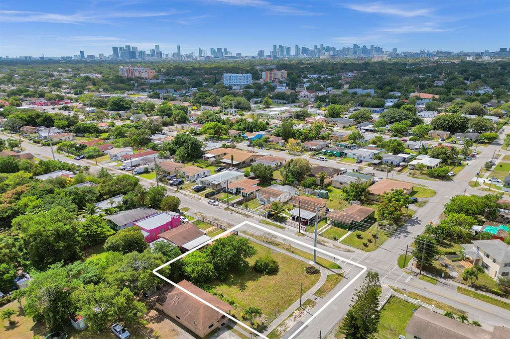1895 Northwest 58th Street Miami, FL 33142 - Photo 7 of 14 an aerial view of residential houses with outdoor space and trees