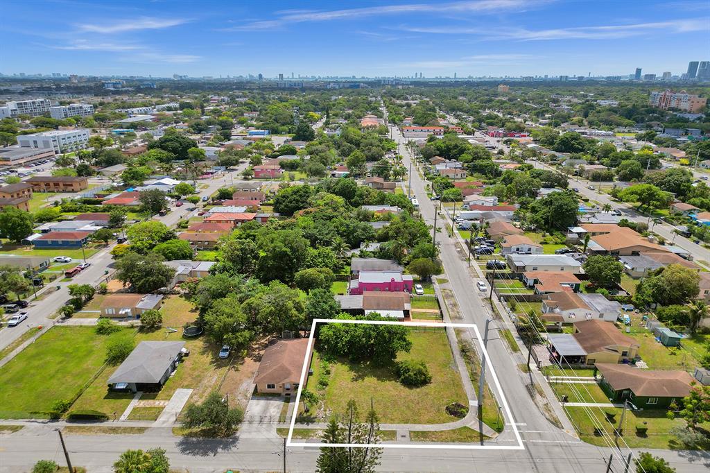 1895 Northwest 58th Street Miami, FL 33142 - Photo 8 of 14 an aerial view of residential houses with outdoor space