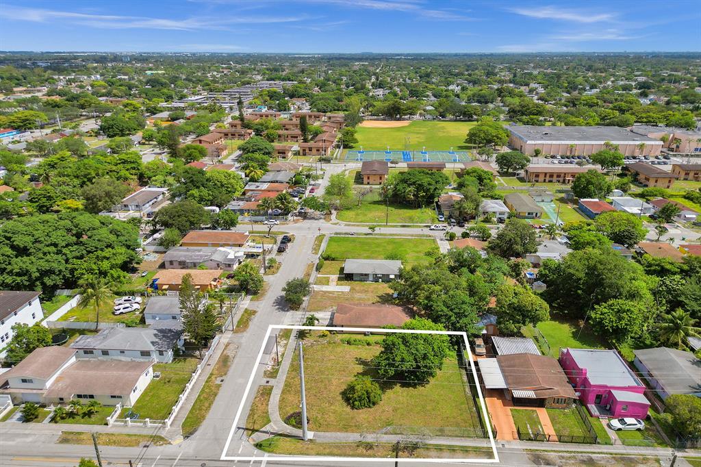 1895 Northwest 58th Street Miami, FL 33142 - Photo 10 of 14 an aerial view of residential houses with outdoor space and swimming pool