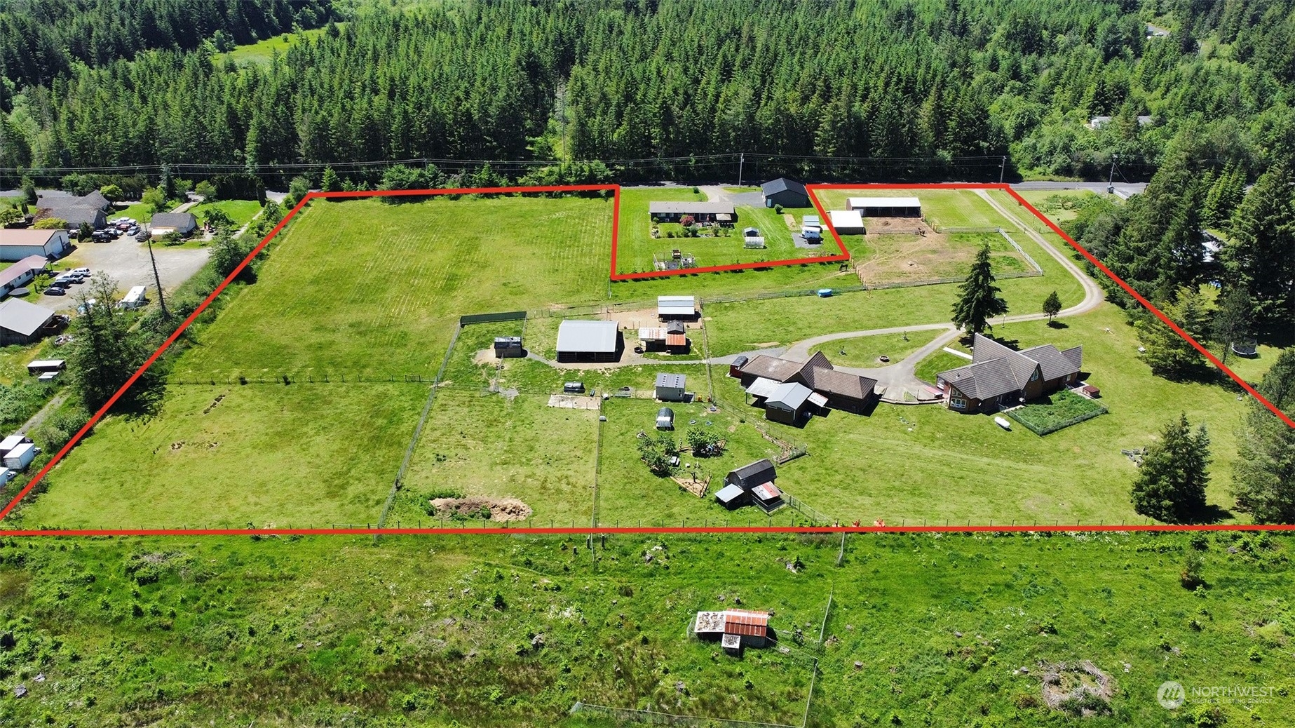 876 Logan Hill Road Chehalis, WA 98532 - Photo 5 of 40 a backyard of a house with lots of green space and fountain