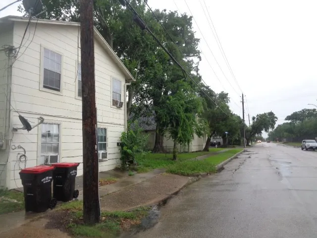 a view of a street with some trees on the side of it