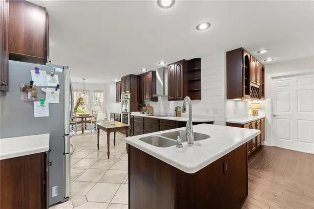 a kitchen with a sink a counter top space and appliances