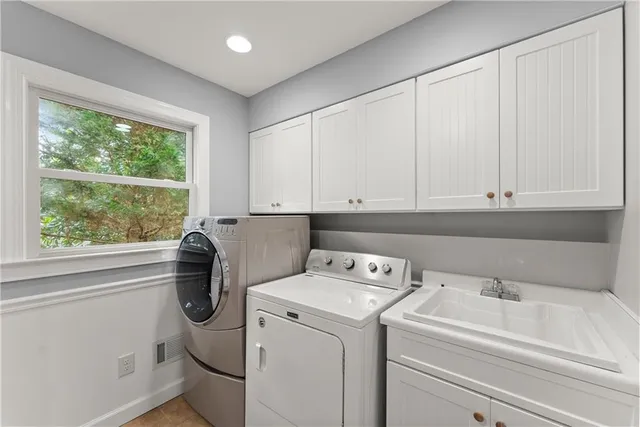 a utility room with dryer and washer