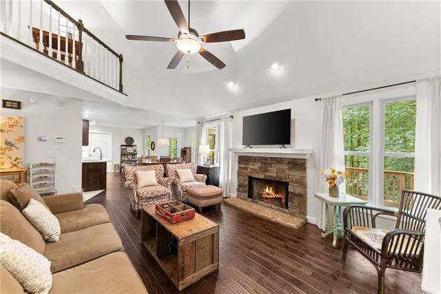 a living room with furniture fireplace and a flat screen tv