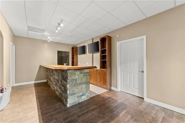 a view of kitchen with microwave and cabinets