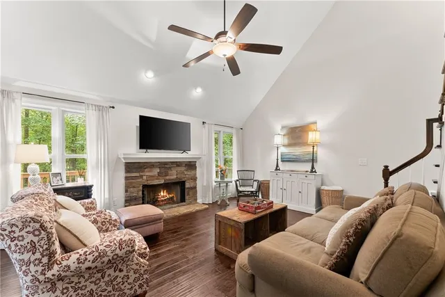 a living room with furniture fireplace and window