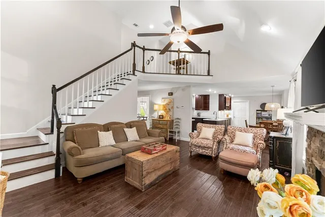 a living room with furniture or couch and a chandelier