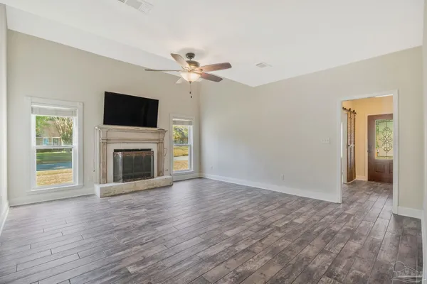 a white bath tub sitting next to a window