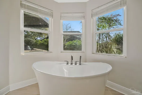 a view of room with window and wooden floor