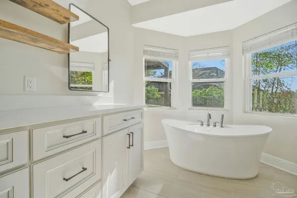 a bathroom with a shower and a bathtub