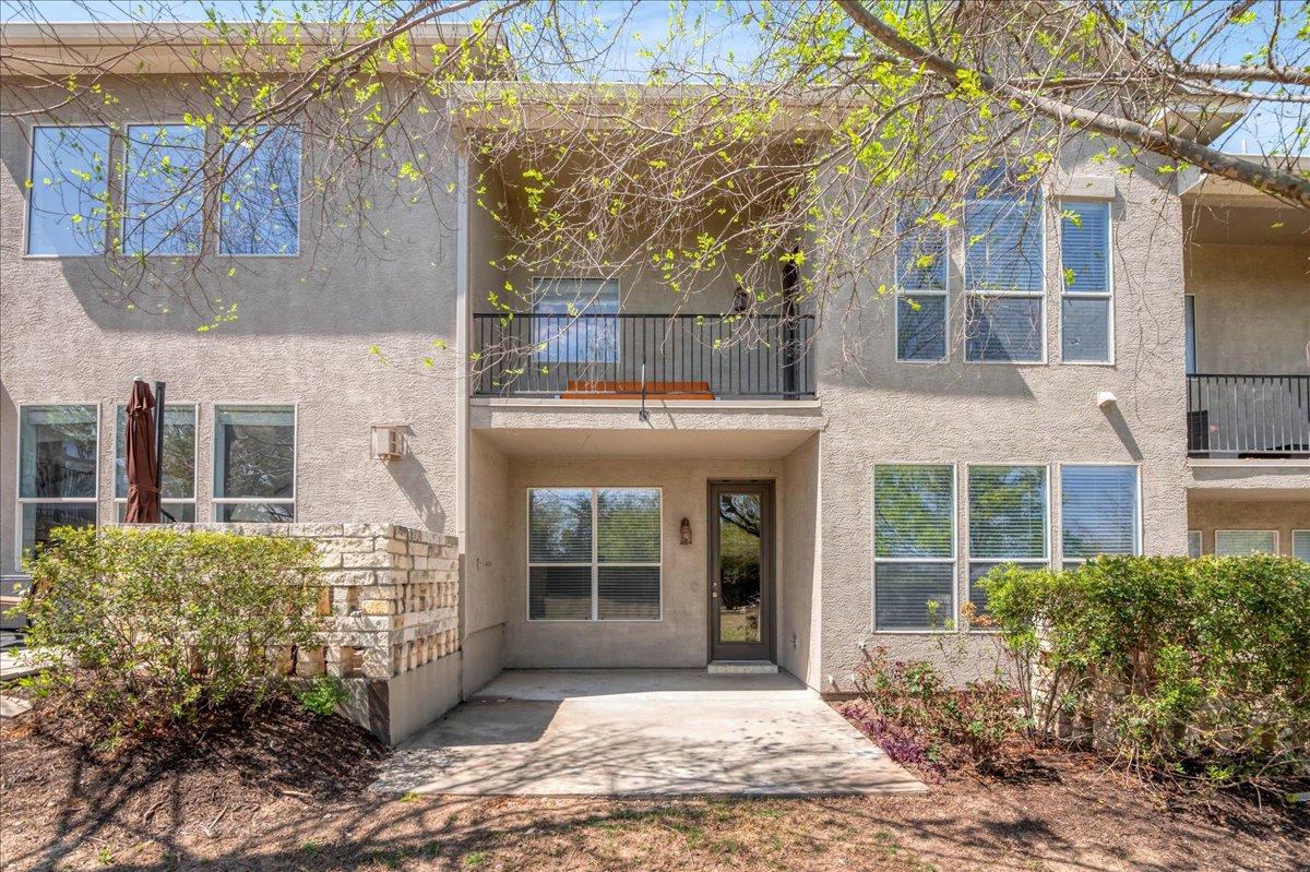 114 Aria Ridge, Unit 802 Lakeway, TX 78738 - Photo 27 of 30 a view of entrance gate of brick building