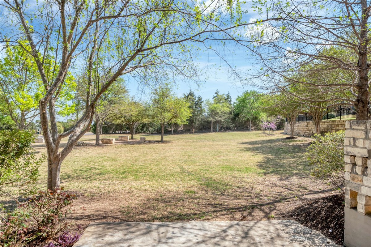 114 Aria Ridge, Unit 802 Lakeway, TX 78738 - Photo 28 of 30 a view of yard with large trees