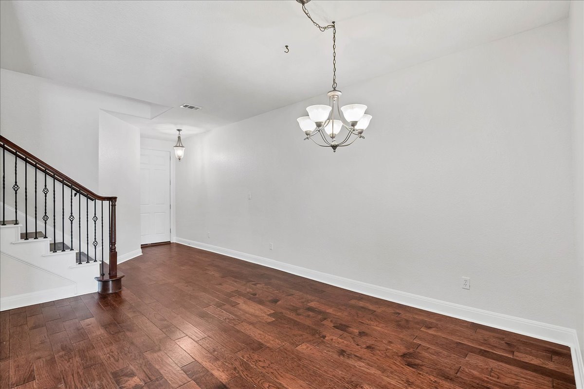 114 Aria Ridge, Unit 802 Lakeway, TX 78738 - Photo 4 of 30 a view of an empty room with wooden floor