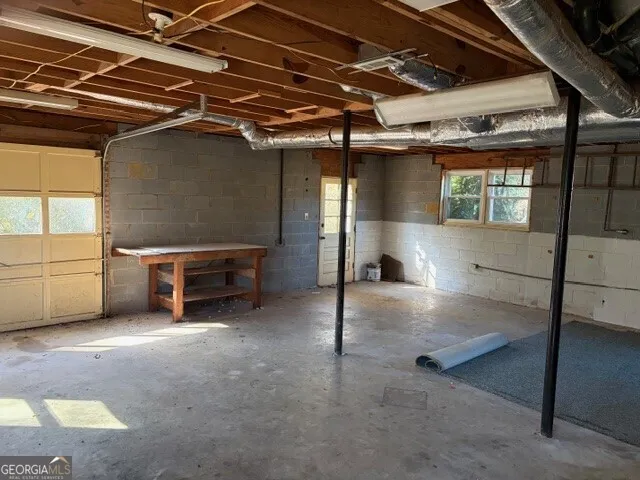 a view of a garage room with stairs