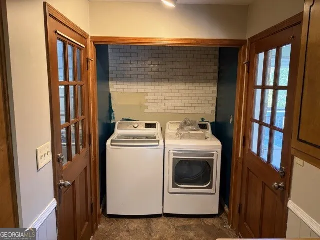 a utility room with dryer and washer