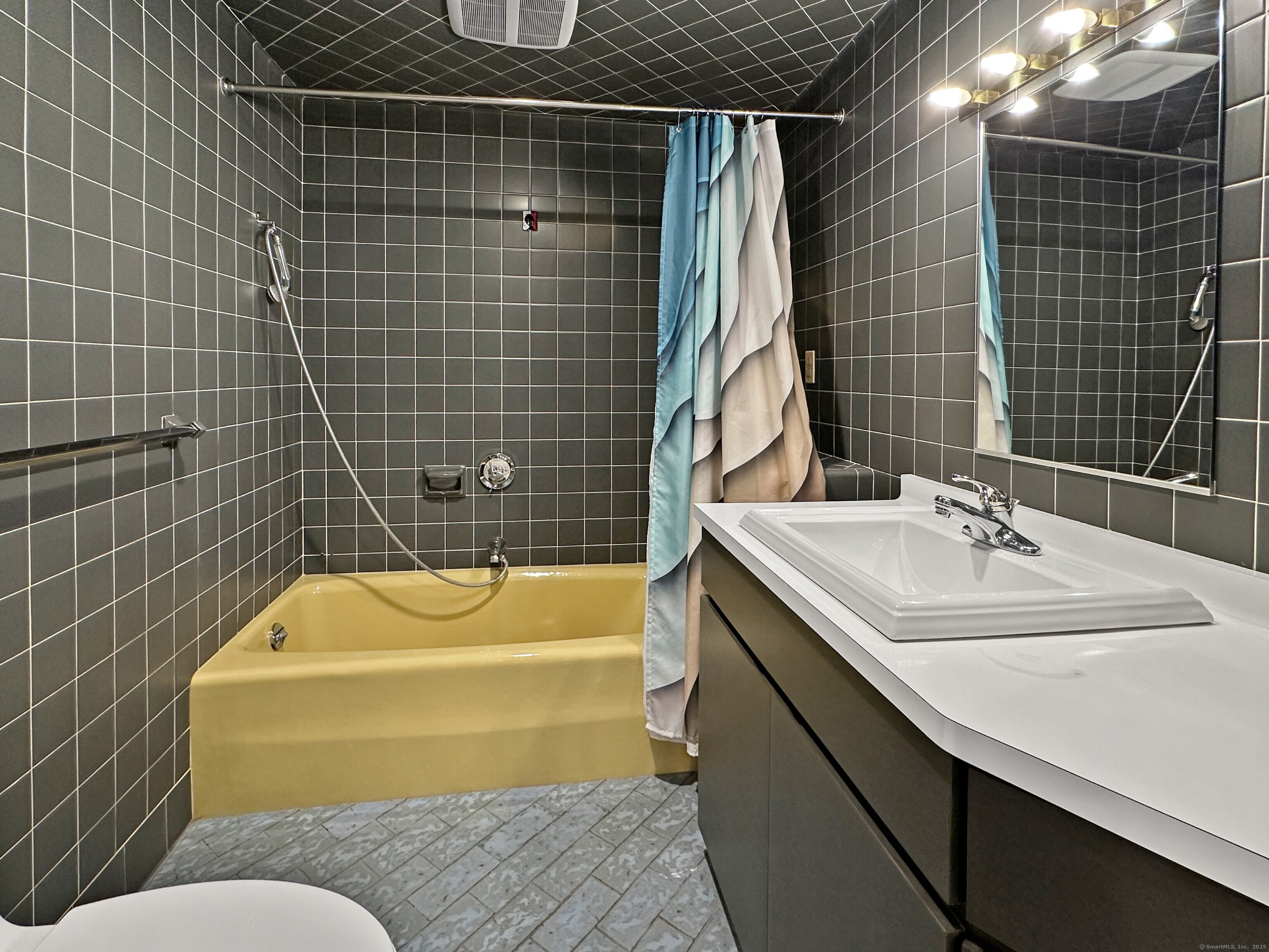 301 Bell Street Middletown, CT 06457 - Photo 19 of 40 a bathroom with a sink and bathtub