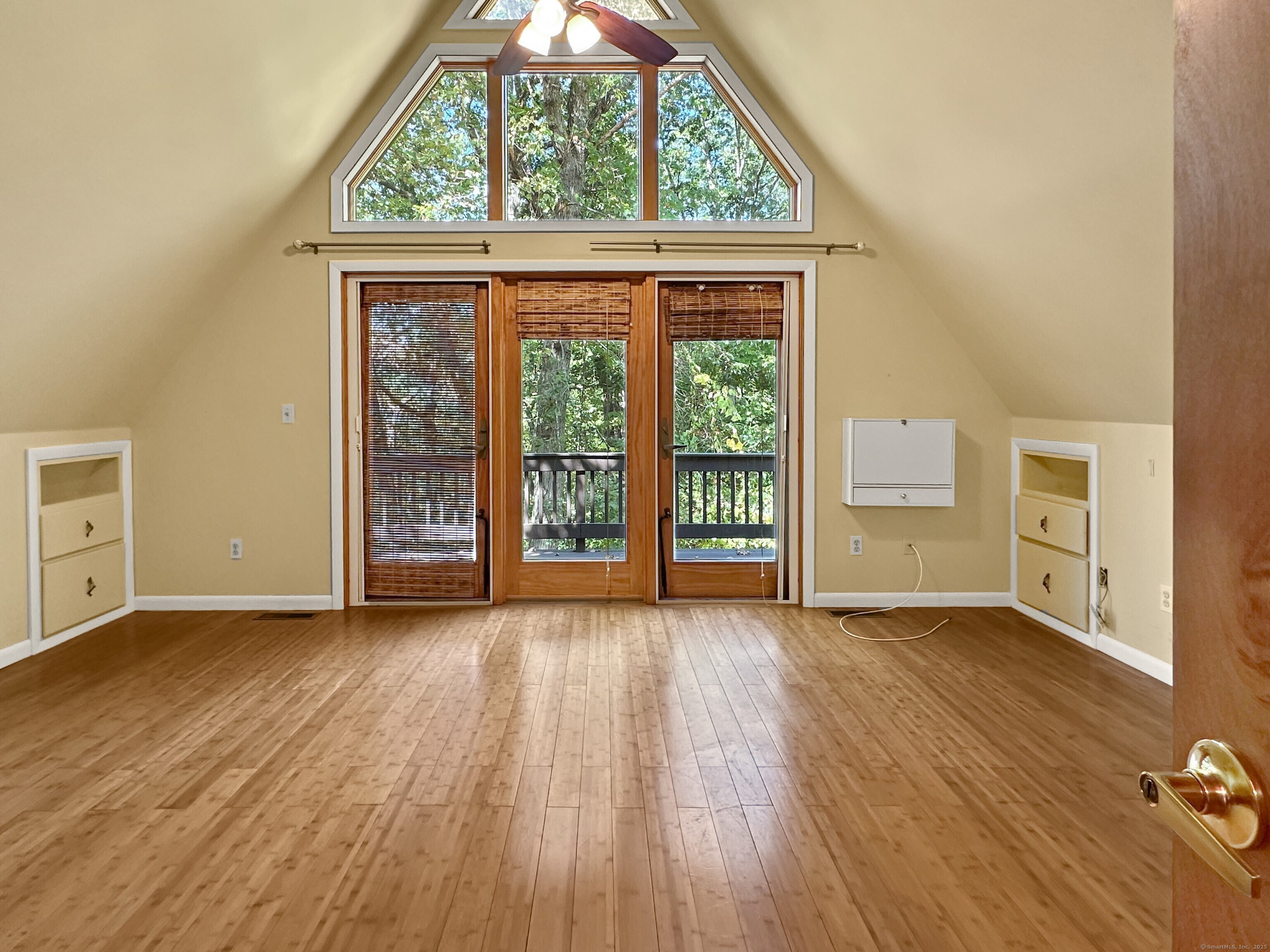 301 Bell Street Middletown, CT 06457 - Photo 21 of 40 an empty room with wooden floor and windows