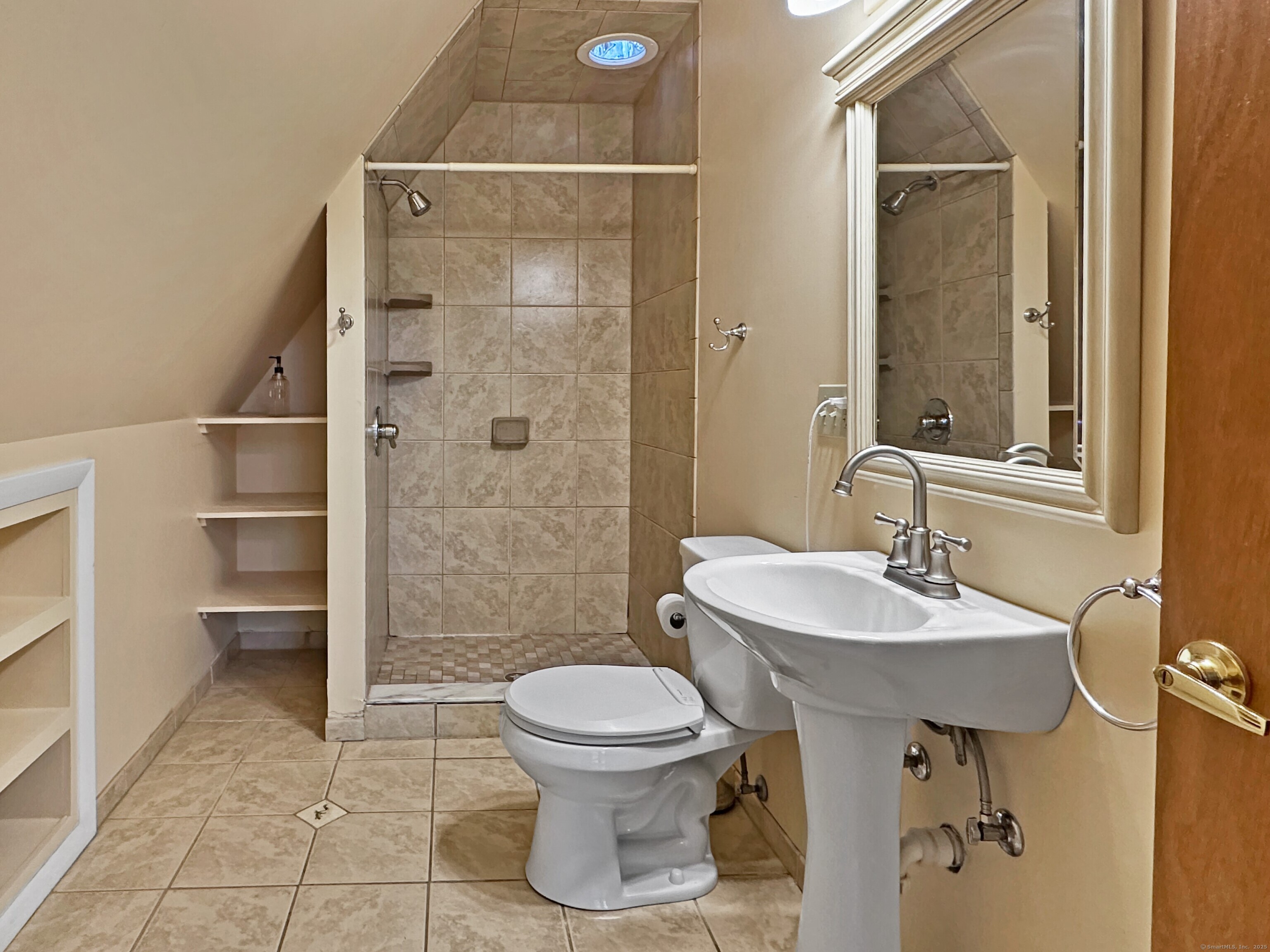 301 Bell Street Middletown, CT 06457 - Photo 23 of 40 a bathroom with a sink toilet and shower