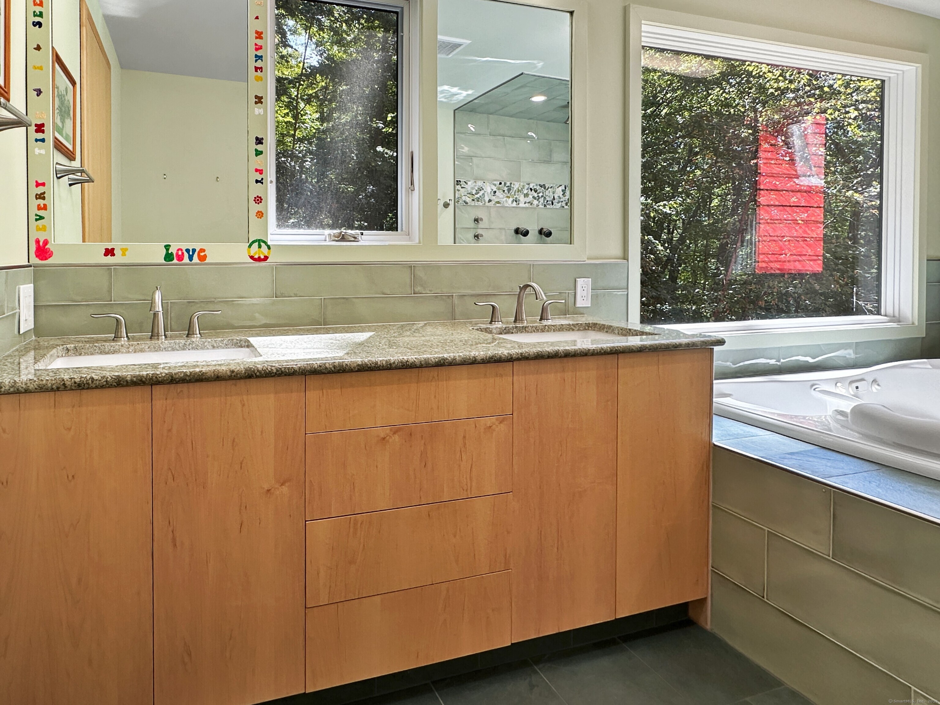 301 Bell Street Middletown, CT 06457 - Photo 29 of 40 a bathroom with a granite countertop sink and a mirror
