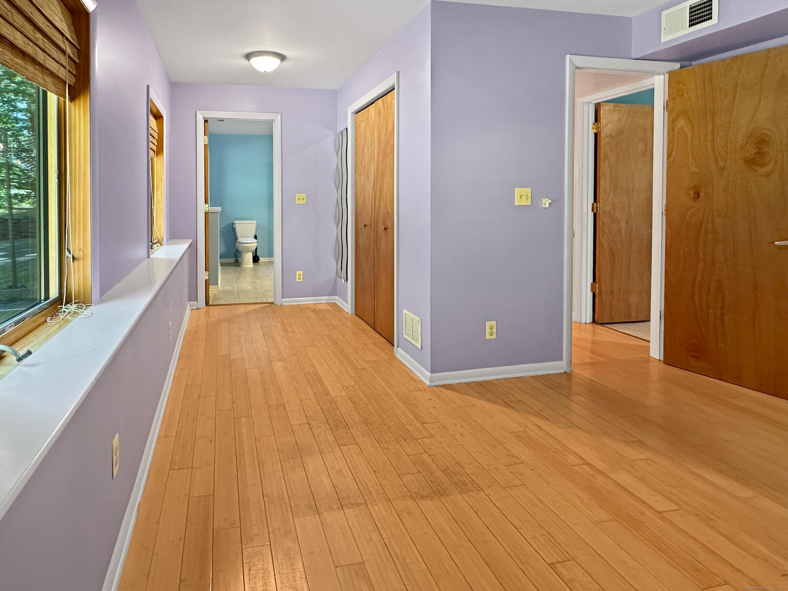 301 Bell Street Middletown, CT 06457 - Photo 33 of 40 a view of a room with wooden floor and door