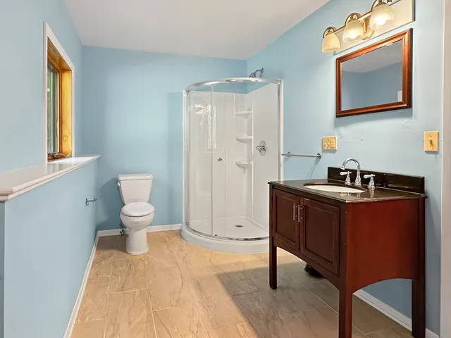 a view of an empty room with windows