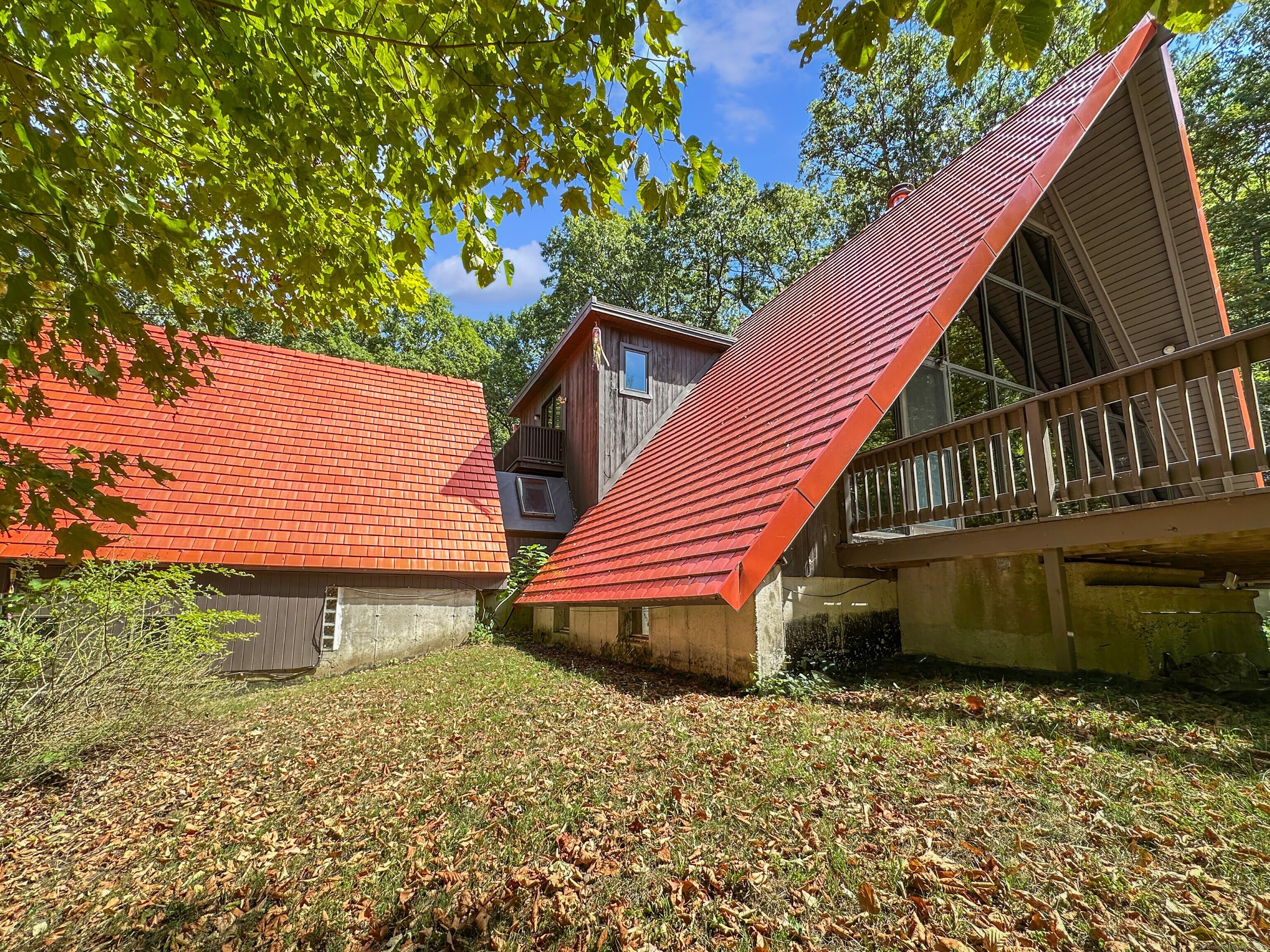 301 Bell Street Middletown, CT 06457 - Photo 8 of 40 a backyard of a house with wooden deck and a garden
