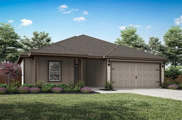 a front view of a house with a garden and garage